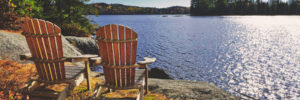 Chairs on a lake front, cottage views,